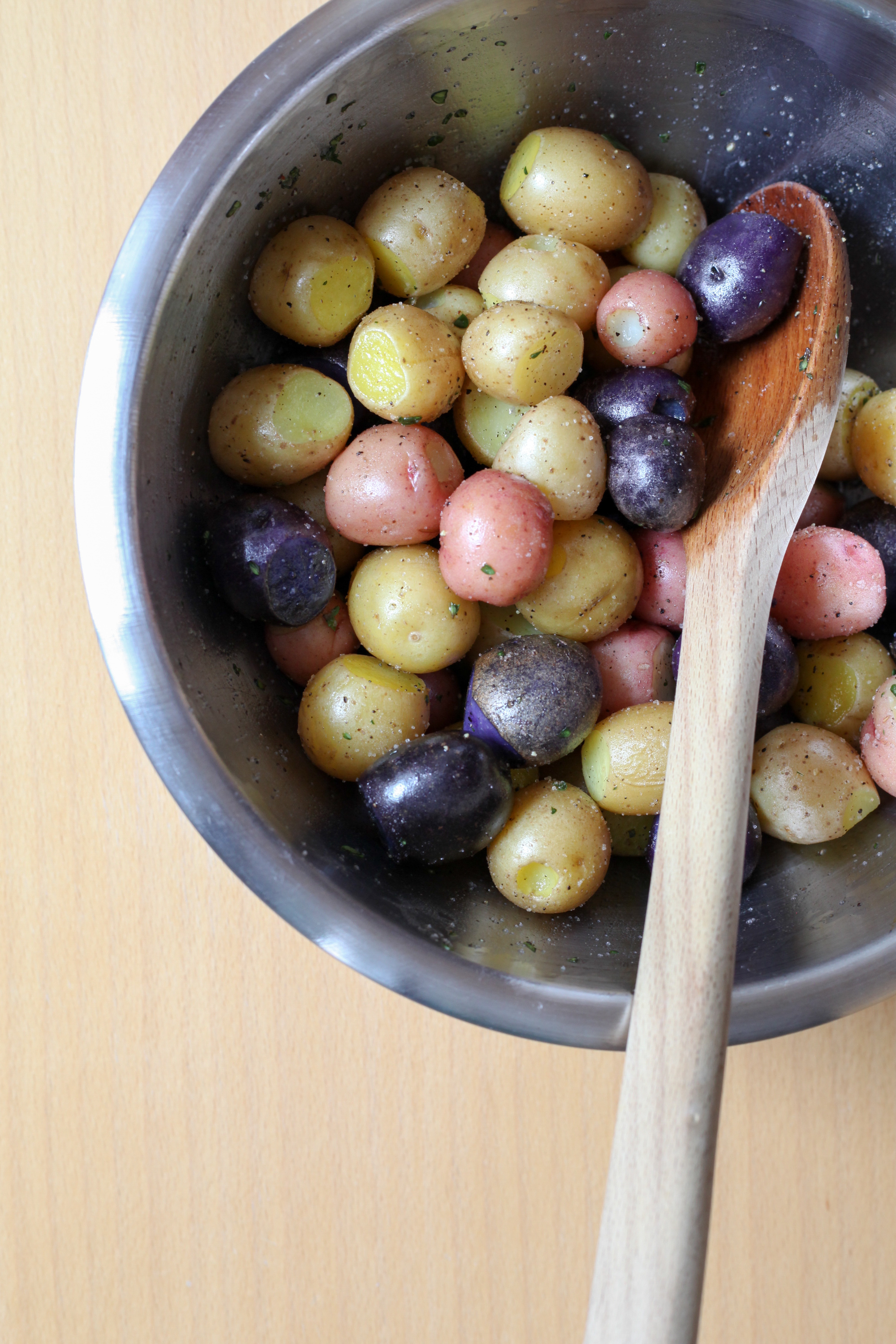 Tossing potatoes with duck fat