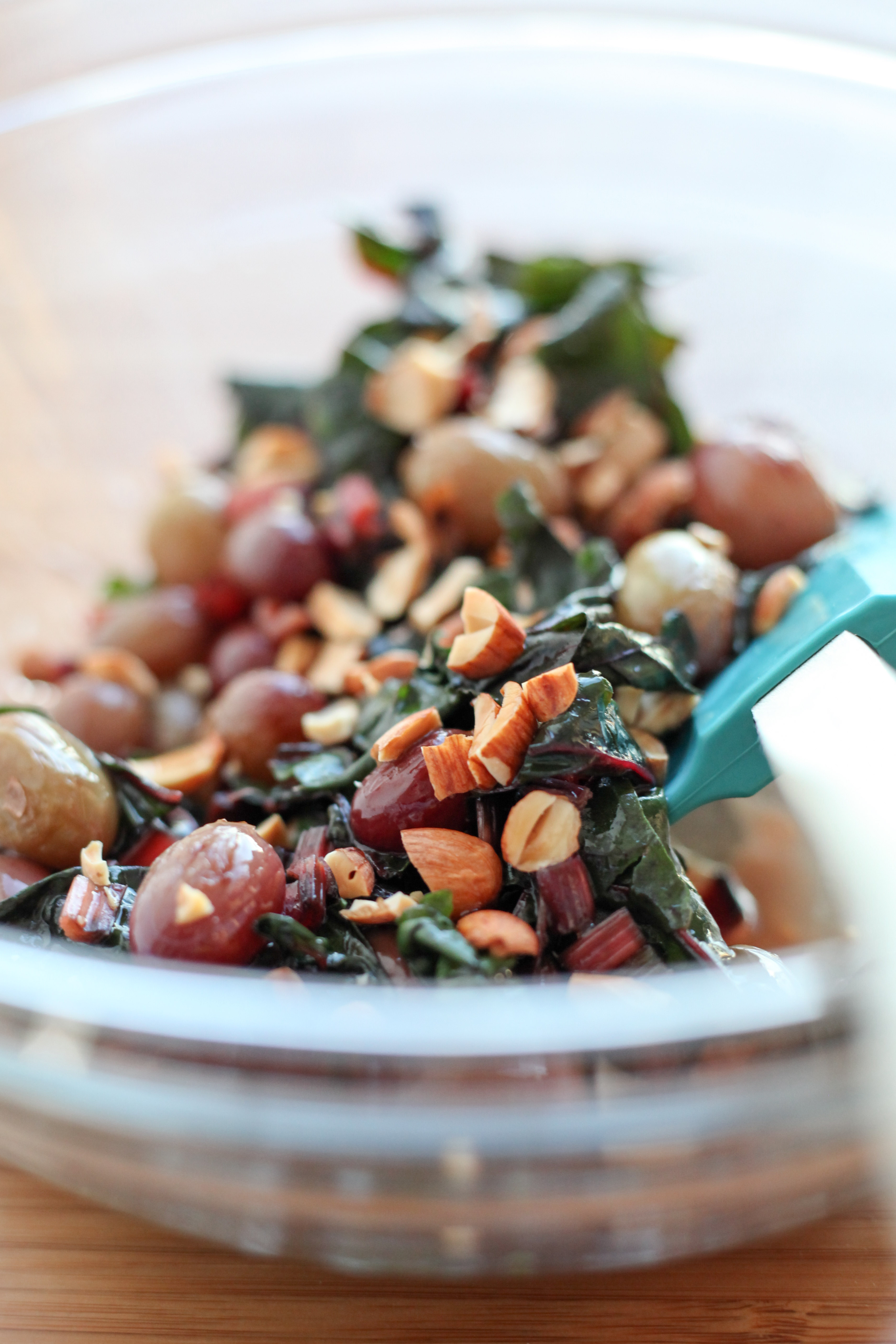Wilted chard with toasted almonds and grapes