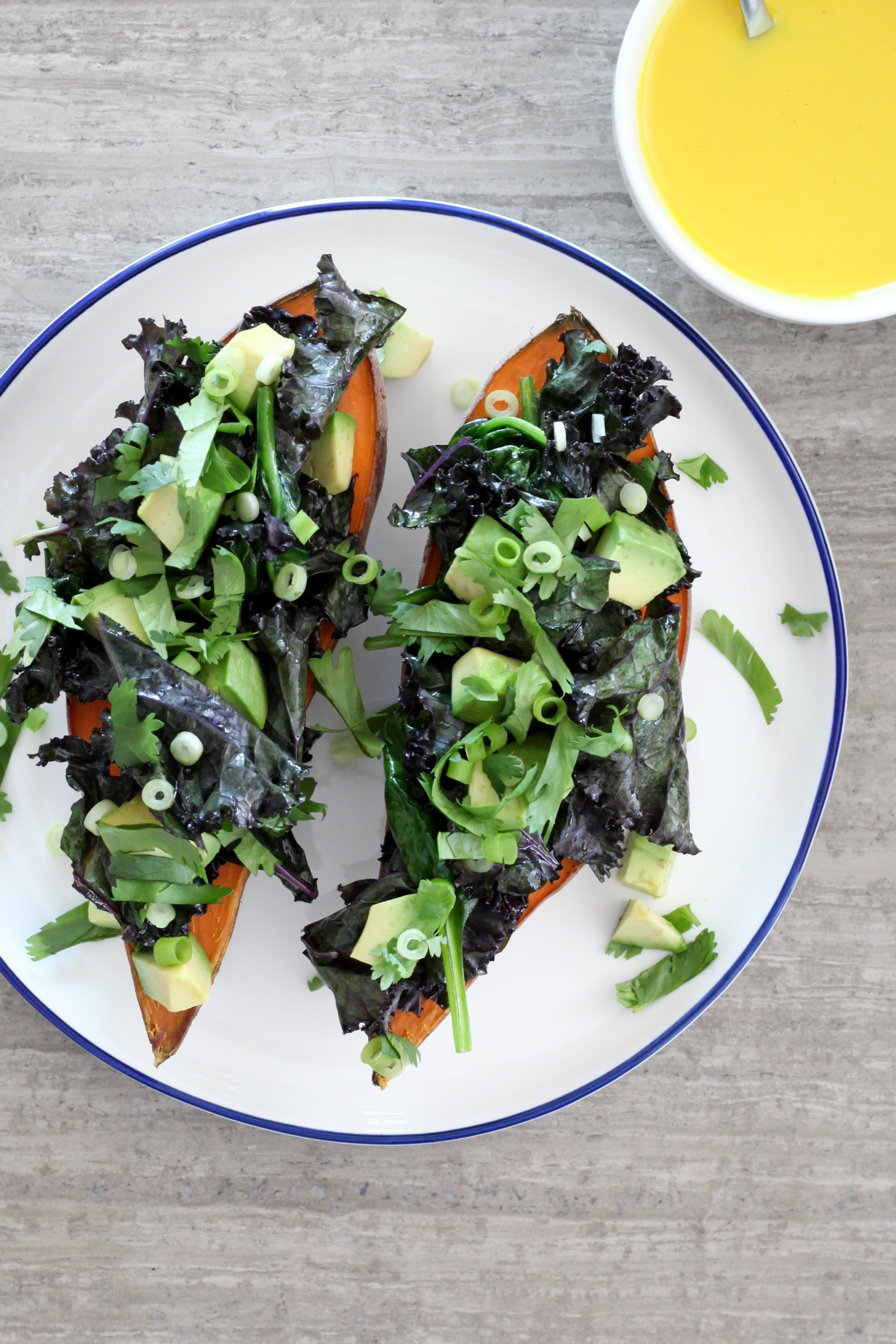 Baked Sweet Potato With Spinach, Kale, and Avocado with Turmeric-Tahini Dressing | amodestfeast.com | @amodestfeast