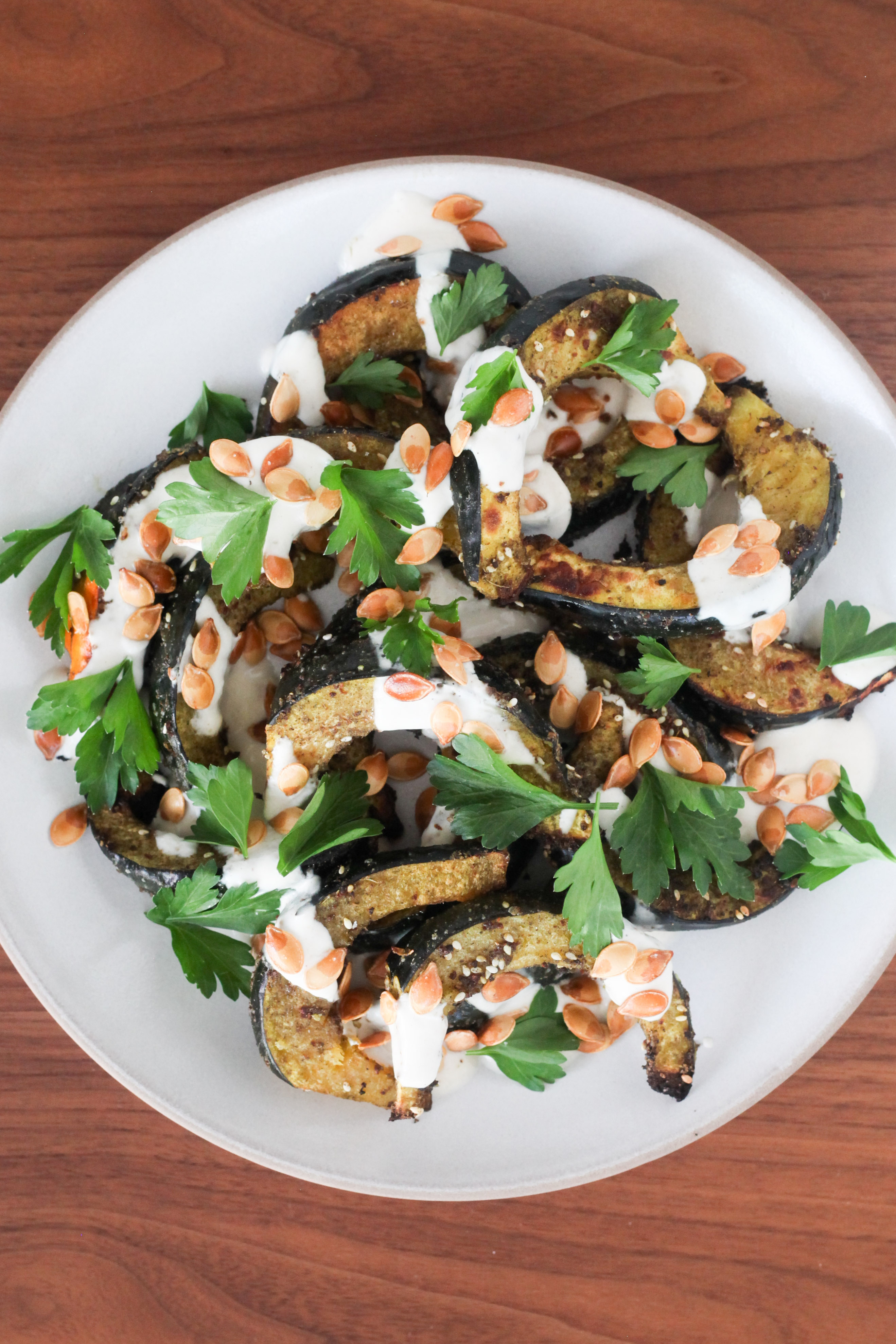 Roasted Acorn Squash With Tahini-Yogurt Sauce | amodestfeast.com | @amodestfeast