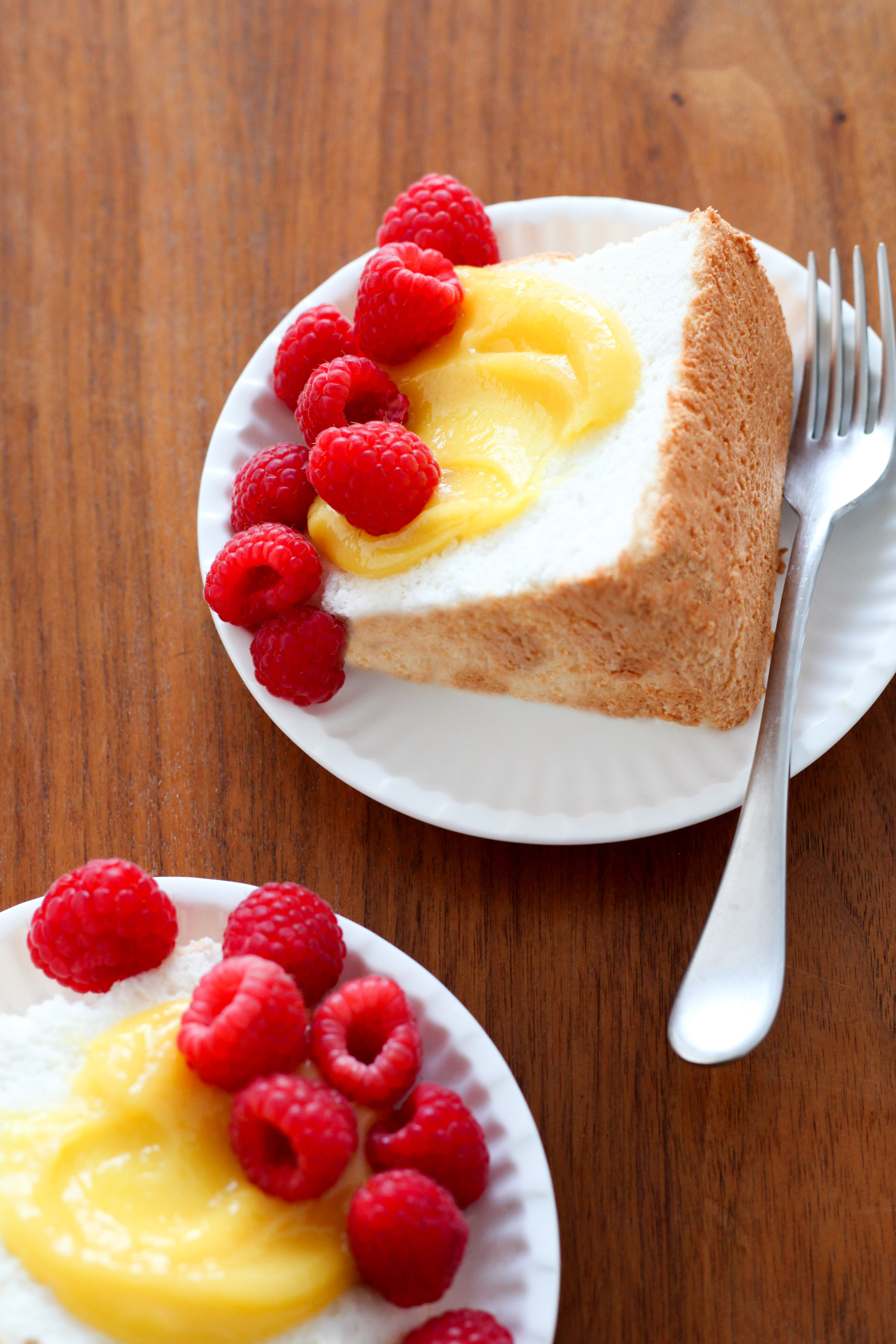 Angel Food Cake With Lemon Curd and Raspberries | amodestfeast.com | @amodestfeast