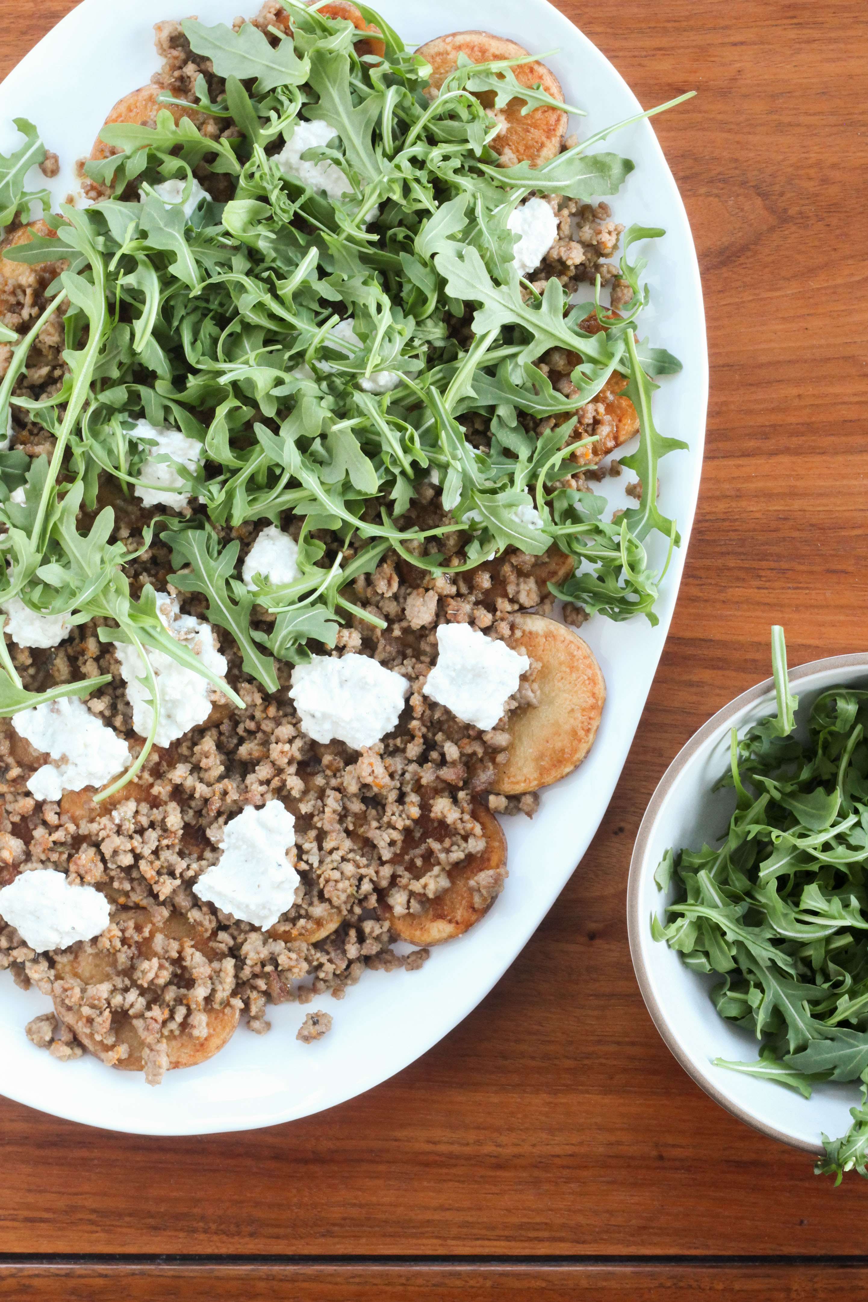 Greek "Poutine" With Arugula (Roasted Potatoes With Feta, Spiced Pork, and Arugula) | amodestfeast.com | @amodestfeast 